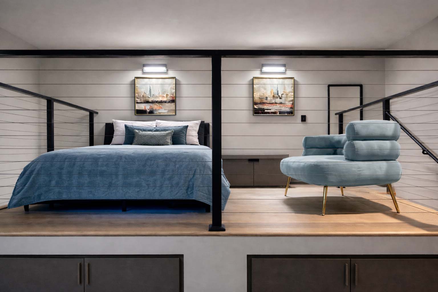 A bedroom with a bed and a chair.